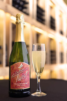 Bottle and glass of Christine's Twist sparkling wine