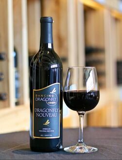 Picture of a bottle and a glass of Dragonfly Nouveau red wine