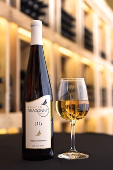 Picture of a bottle and a glass of Jig white wine