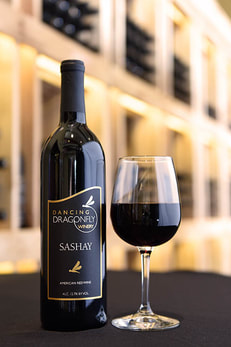 Picture of a bottle and a glass of Sashay red wine