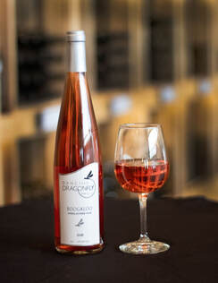 Picture of a bottle and a glass of Boogaloo rosé wine