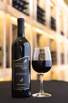 Picture of a bottle and a glass of Conga red wine